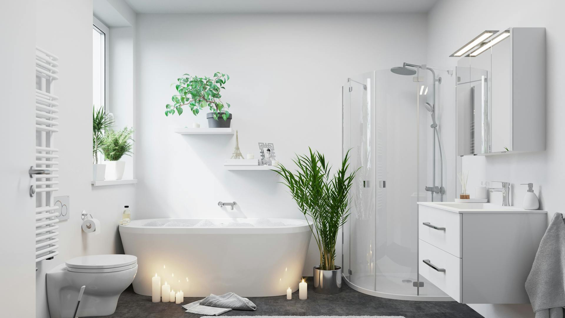 Šedo-bílá koupelna s toaletou, volně stojící vanou, skříňkou s umyvadlem a zrcadlovou skříňkou.