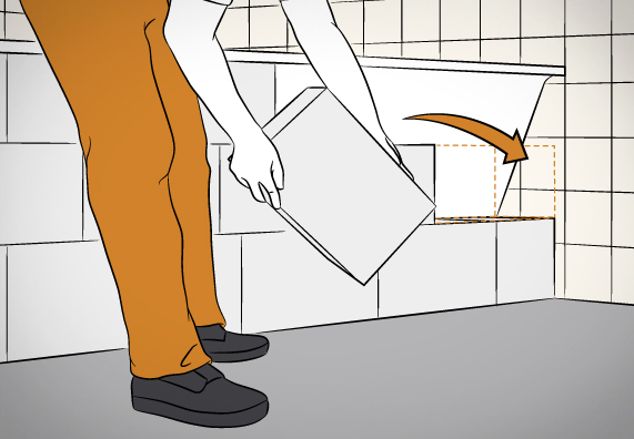 Kutil pokládá ploché tvárnice na sebe pro obezdění vany.