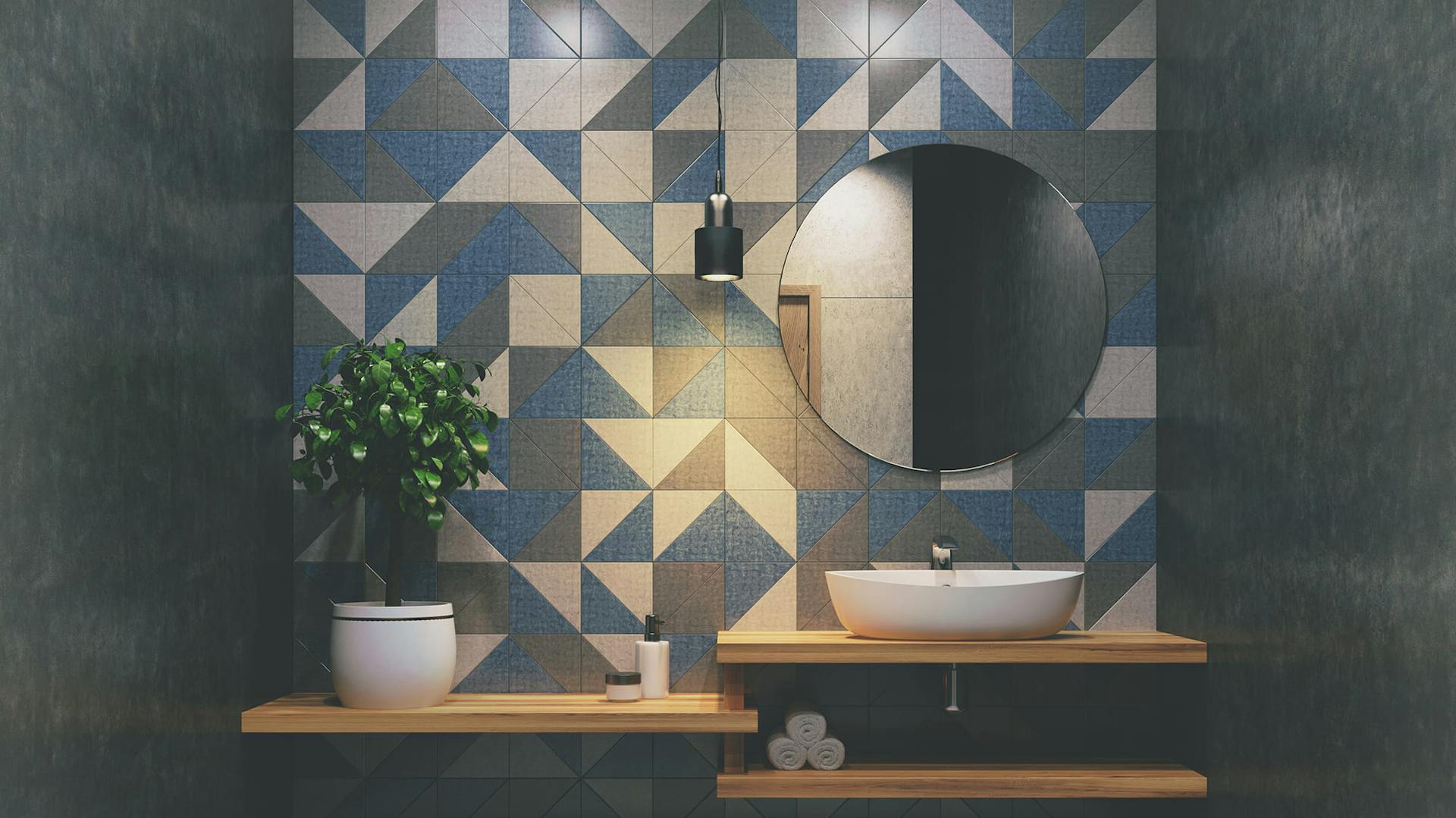 Bad mit grauen und blauen Fliesen.