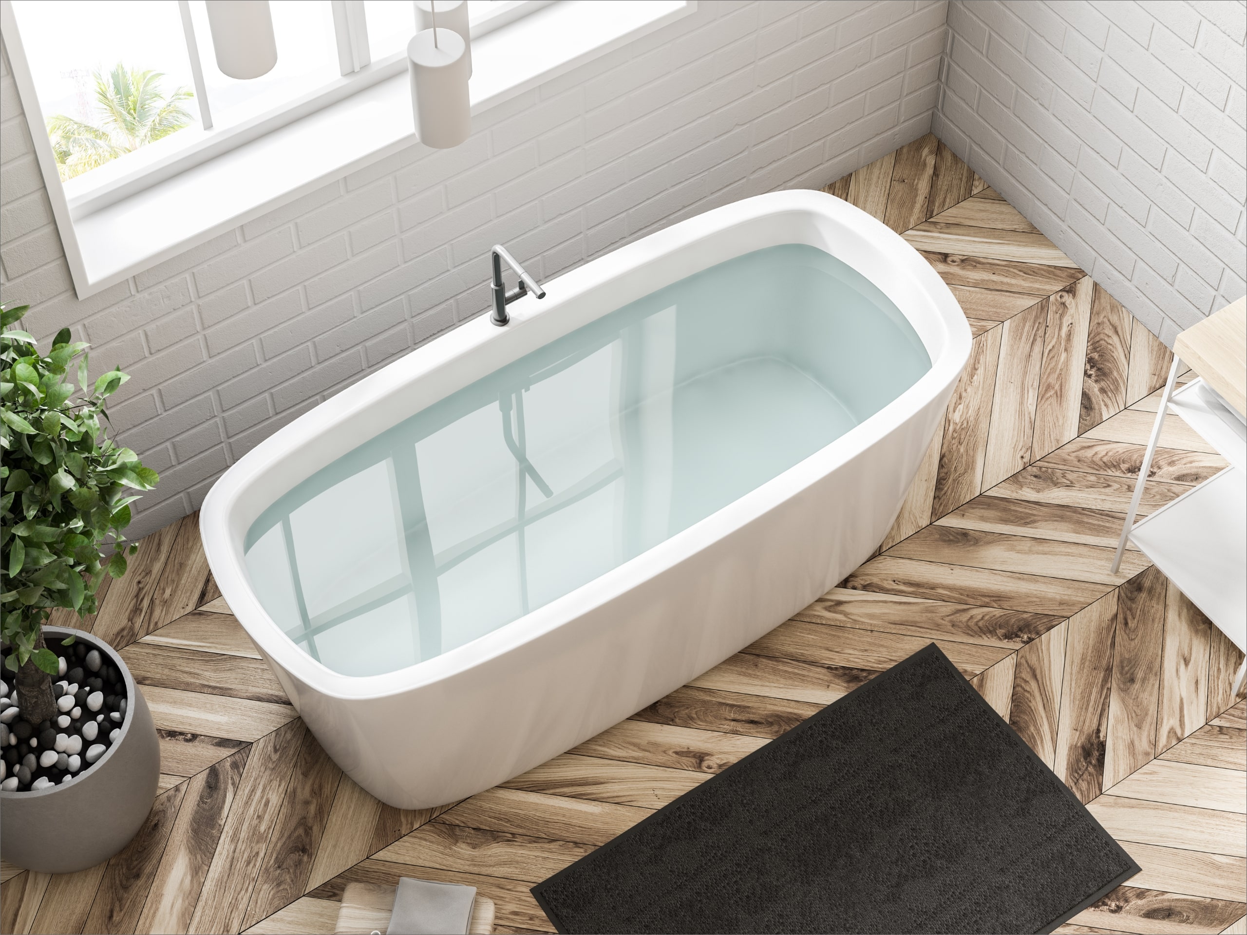 Eine Badewanne auf einem Holzboden.