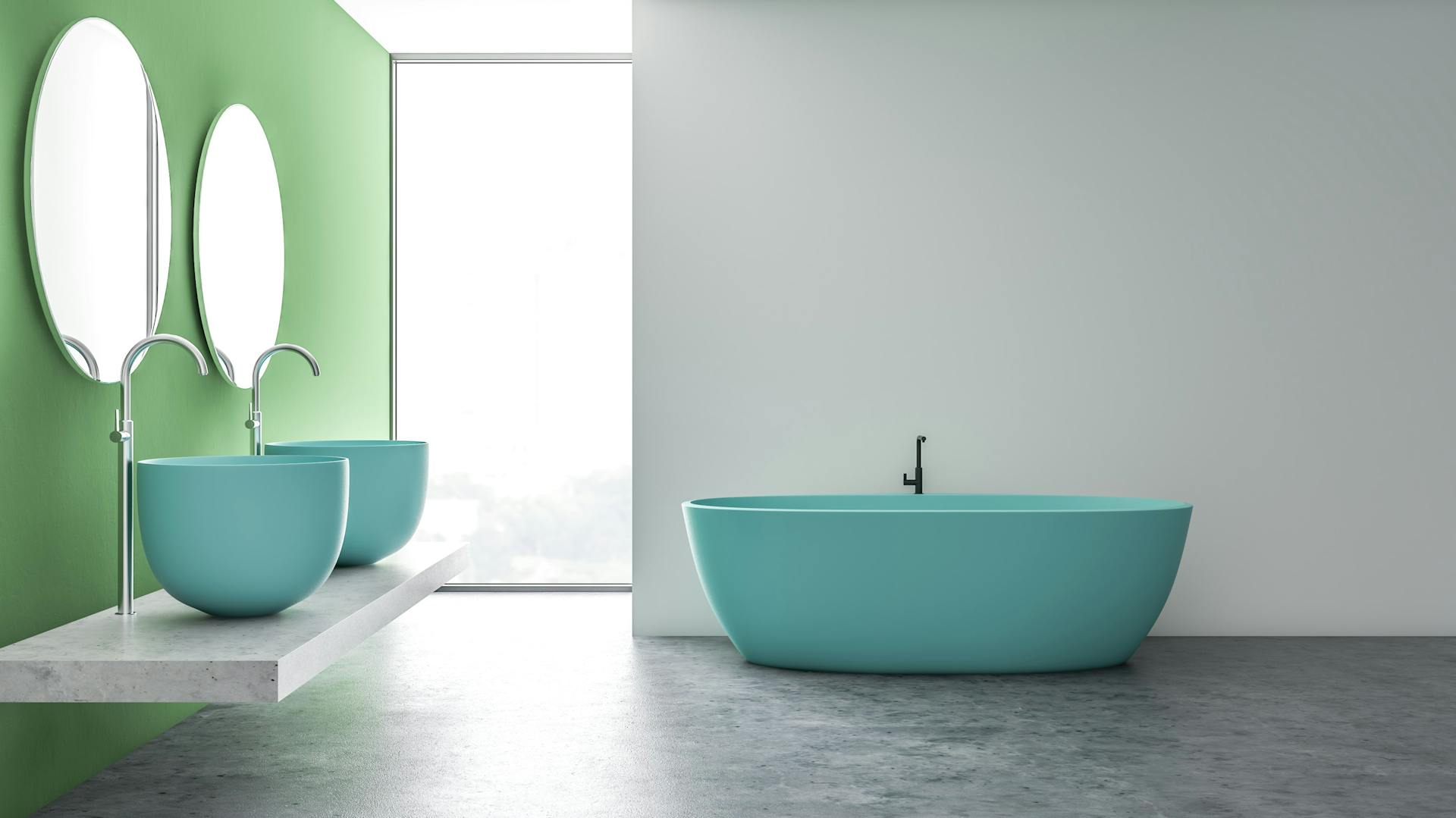 Badezimmer mit einer grünen Wand und einer blauen Keramik-Ausstattung.