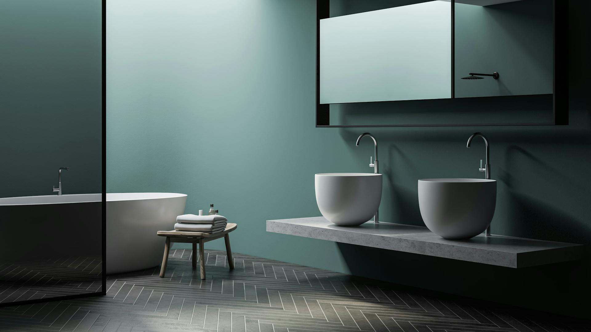 Grünes Bad mit grauem Boden.