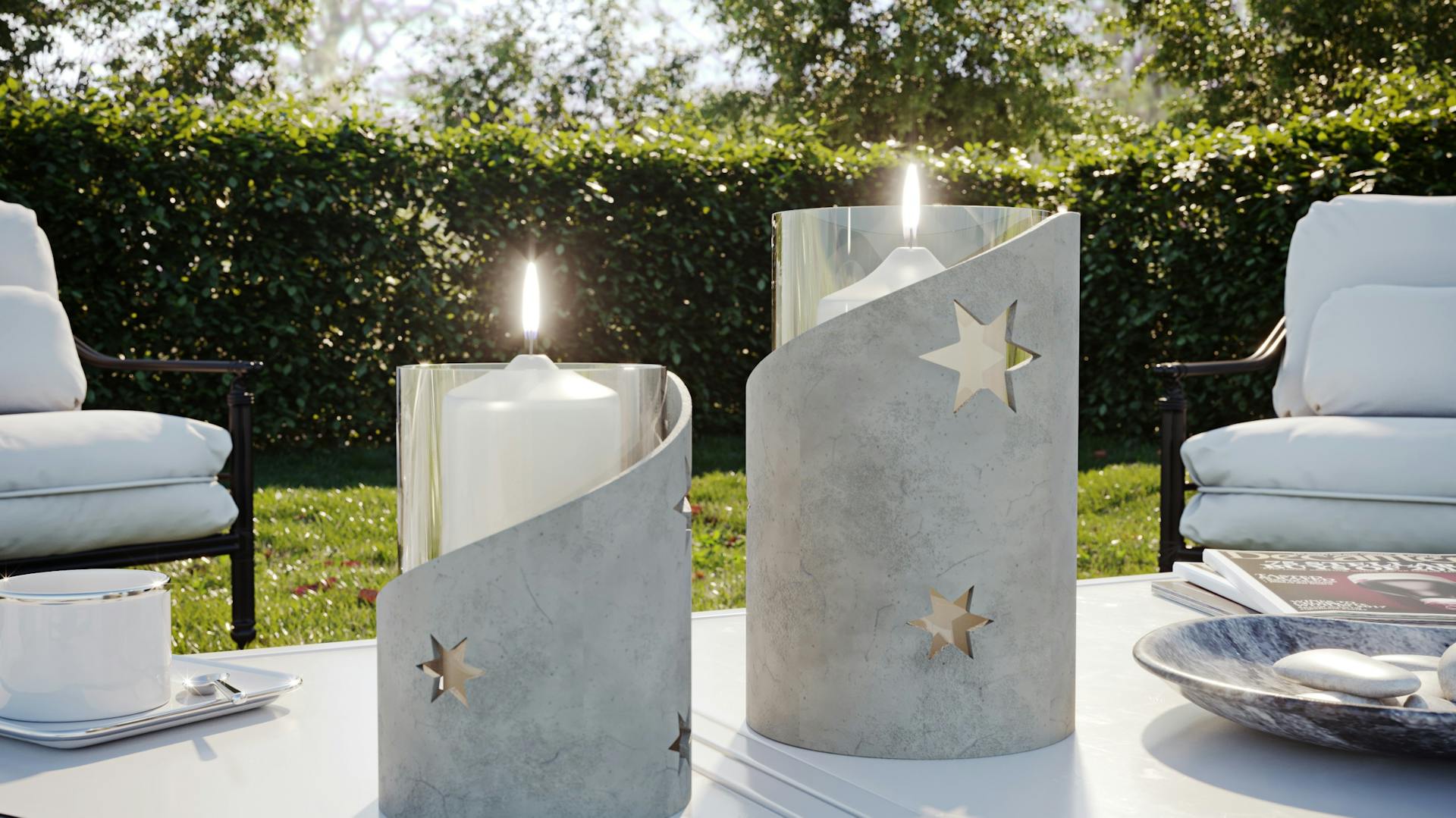 Windlichter aus Bastelbeton auf Tisch in Garten