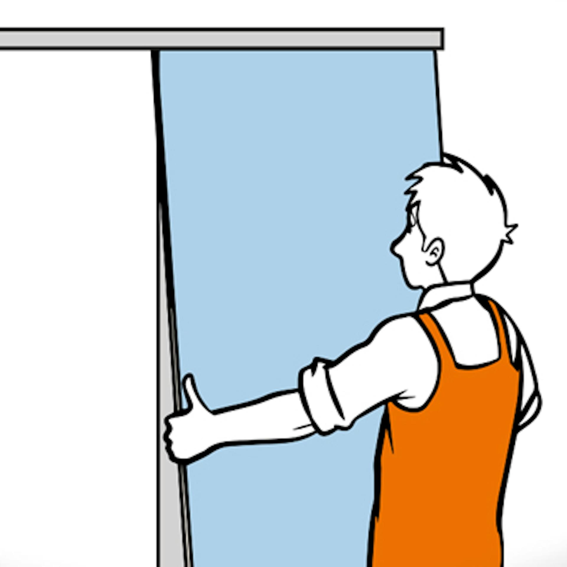 Handwerker hängt Schiebetür in Deckenschiene ein.