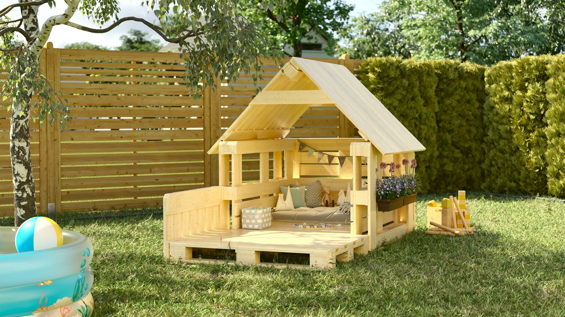 Spielhaus aus Paletten im Garten neben einem Planschbecken