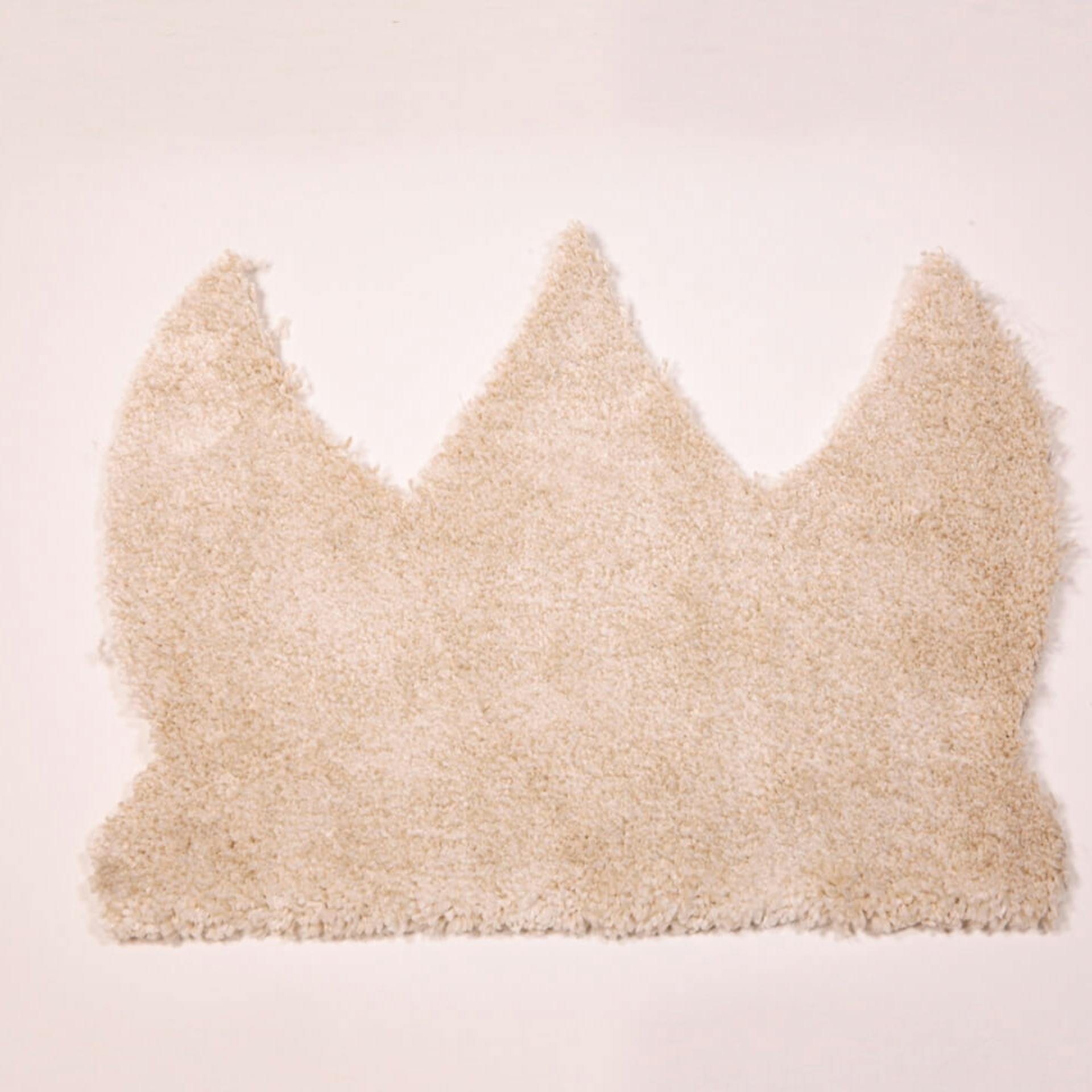 Tappeto beige a forma di corona
