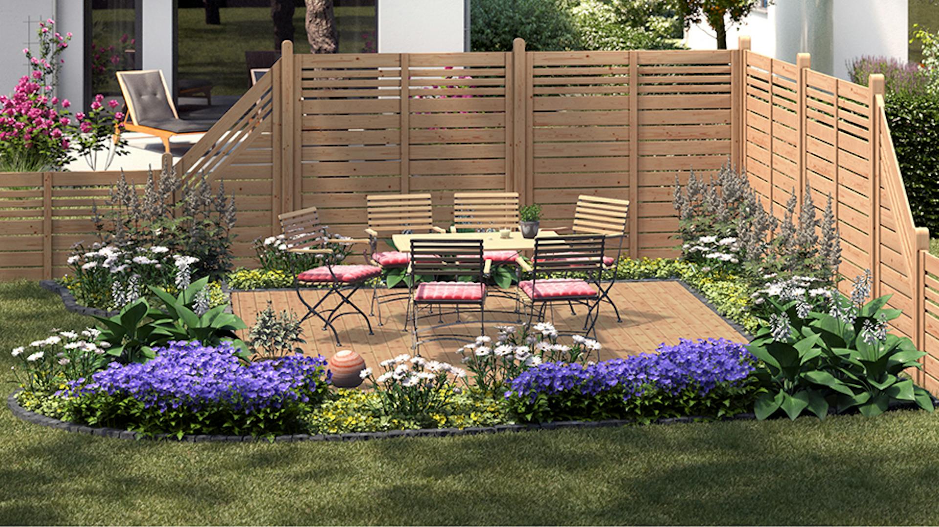 Gartengestaltung klassischer Sitzplatz mit Sitzgruppe aus Holz und Metall auf Steinboden neben Holzzaun und bepflanzten Beeten