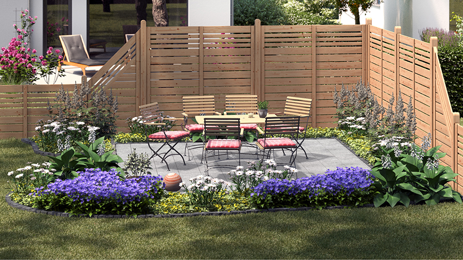 Gartengestaltung klassischer Sitzplatz mit Sitzgruppe aus Holz und Metall auf Steinboden neben Holzzaun und bepflanzten Beeten