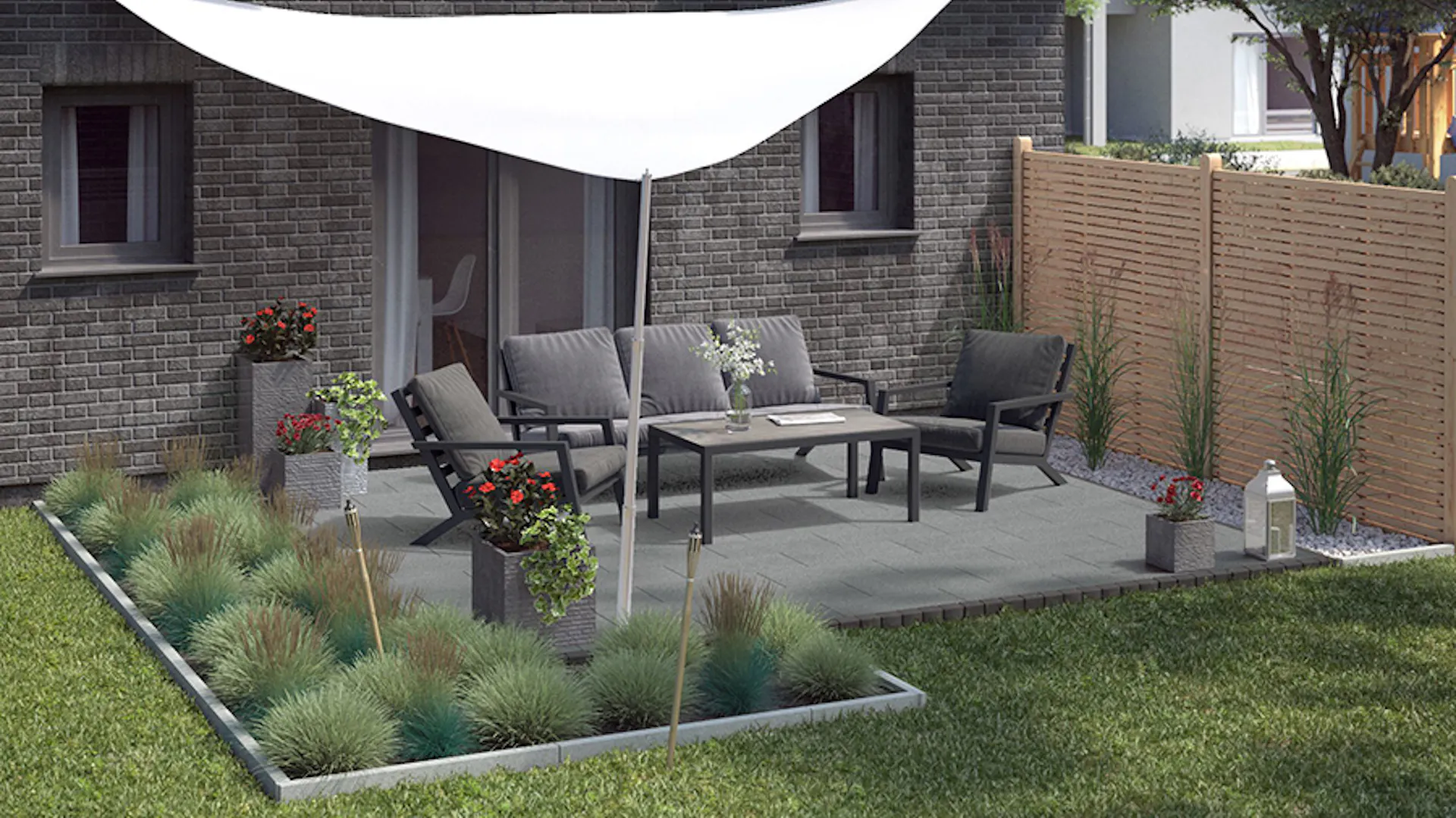 Gartengestaltung moderne Terrasse mit Loungegruppe auf Steinboden unter Sonnensegel an eckigen eingefassten Beeten mit Gräsern neben hohem Holzzaun als Sichtschutz