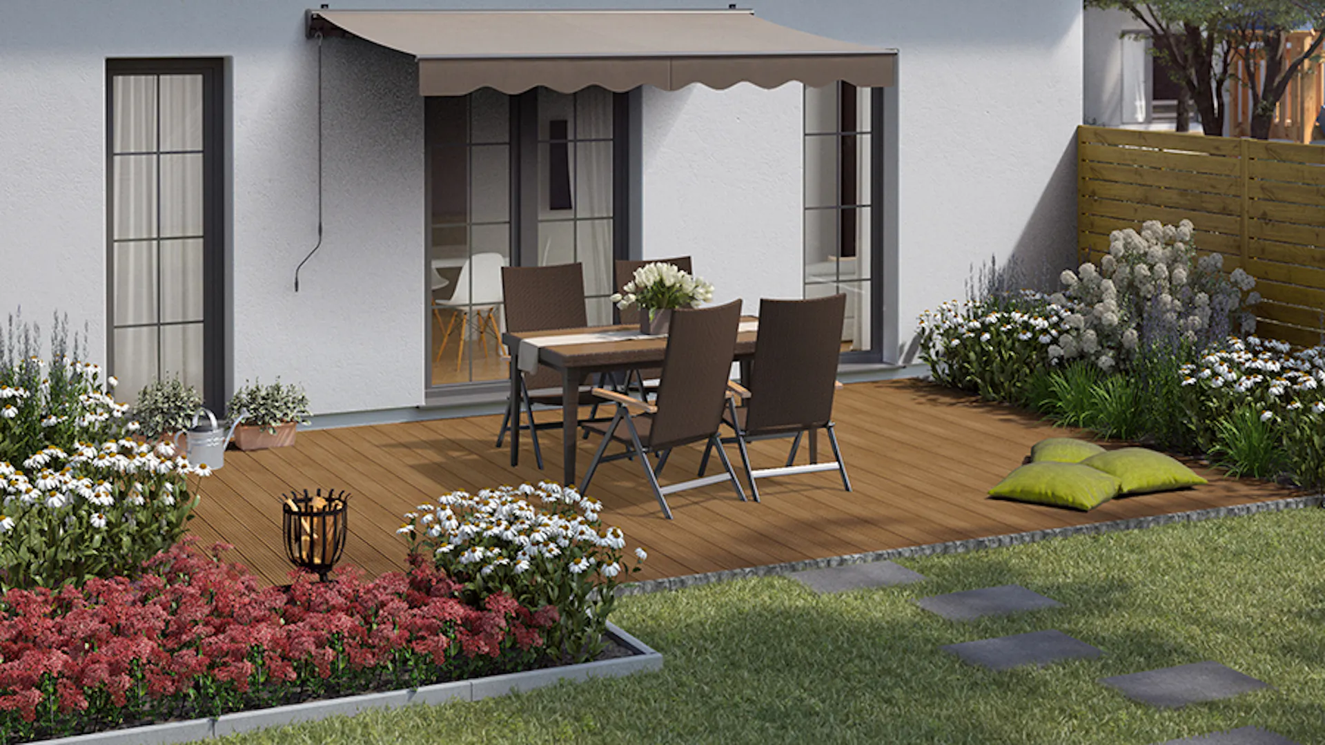 Gartengestaltung natürliche Terrasse mit Sitzgruppe aus Polyrattan auf Holzboden unter Markise neben eingefassten Beeten mit natürlicher Bepflanzung und hohem Holzzaun als Sichtschutz