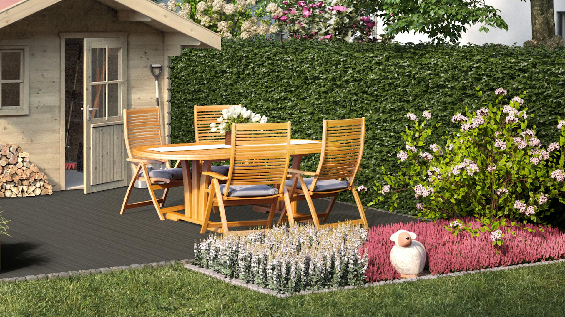 Ideen für die Gartengestaltung klassisches Gartenhaus auf Steinboden mit Sitzgruppe aus Holz vor bepflanzten Beeten