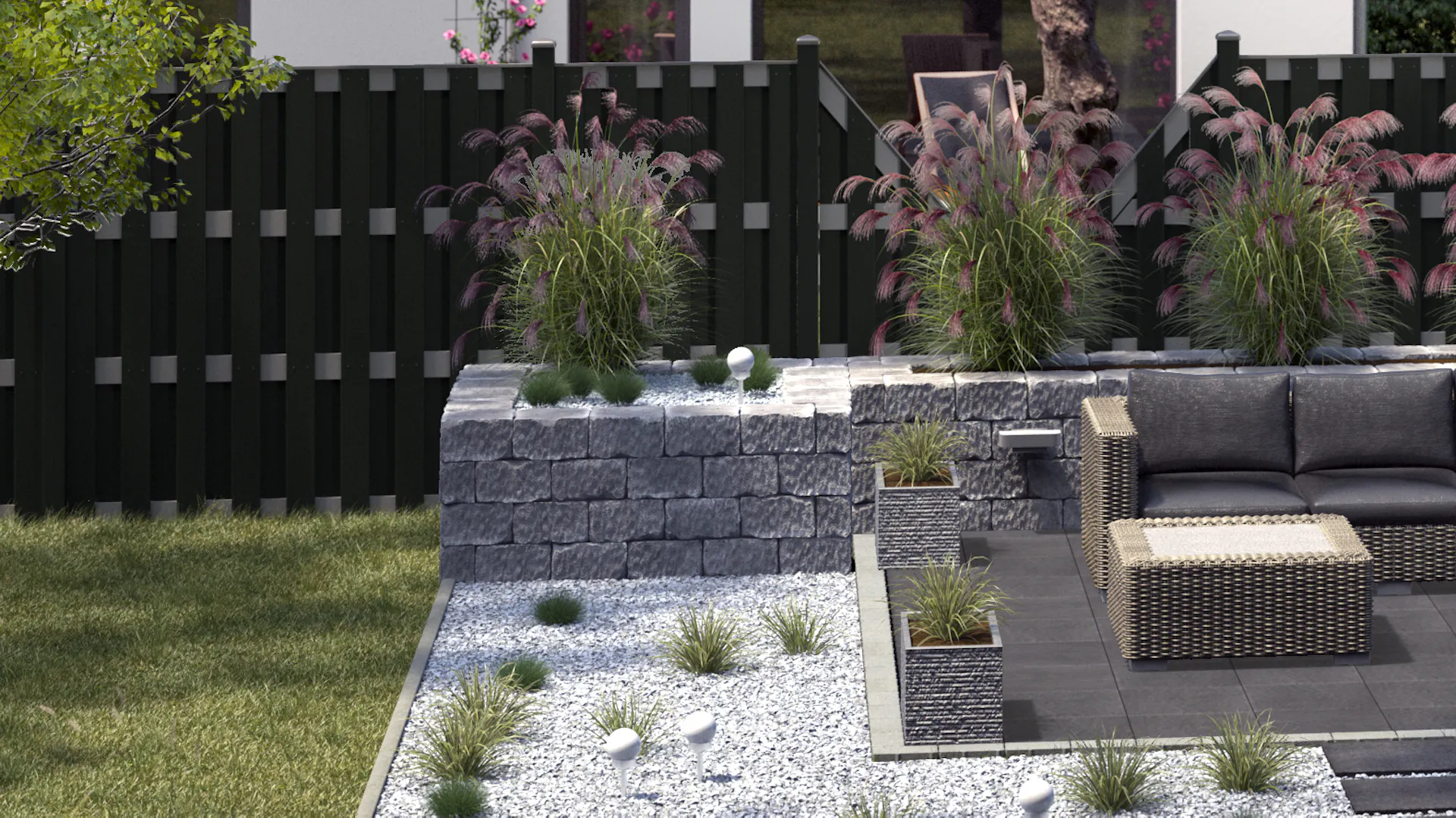 Nápady na úpravu záhrady – moderné sedenie z ratanu na dlažbe pri bodovo vysadenom záhone s ozdobným štrkom