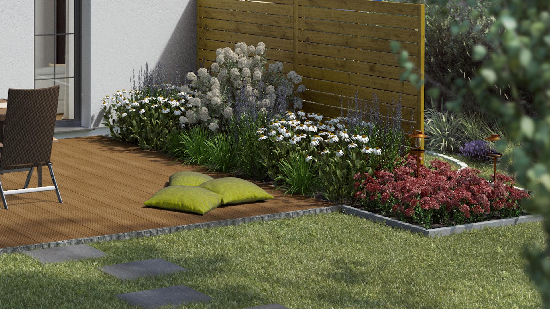 Ideen für die Gartengestaltung natürliche Terrasse mit Holzdielen und grünen Kissen neben natürlich bepflanzten Beeten an hohem Holzzaun als Sichtschutz