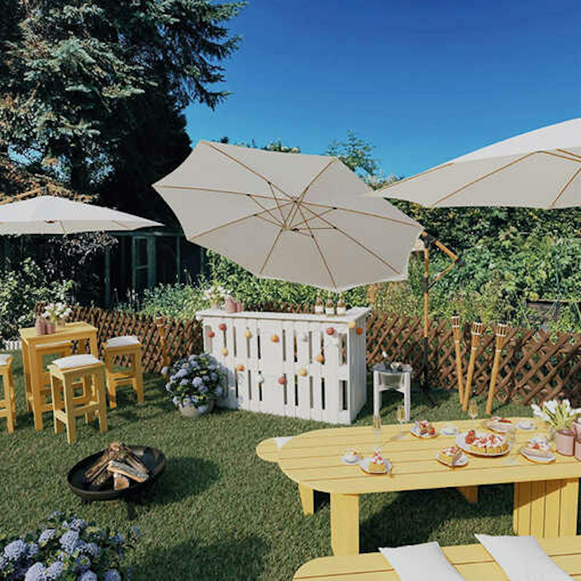 Ein Gartenparty-Bereich mit einer zentralen Theke, neben der die Sitzgruppe Ede Quadratisch steht. Davor steht eine Feuerschale der Gartentisch Emilia mit Sitzbänken.