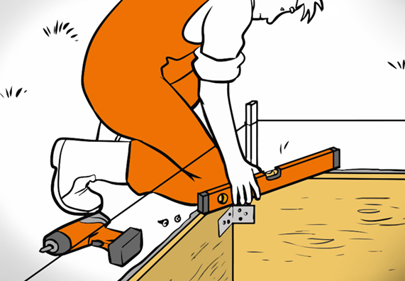 Heimwerker erstellt eine Verschalung für Fundament und prüft mit einer Wasserwaage.