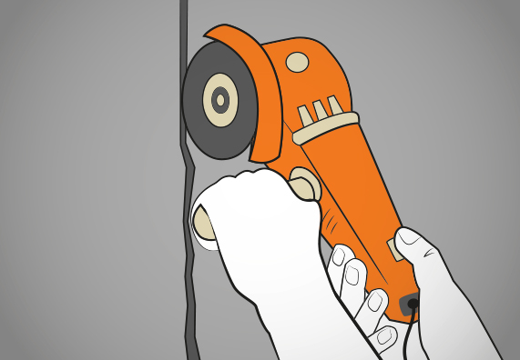 Heimwerker weitet Mauerriss mit Winkelschleifer.