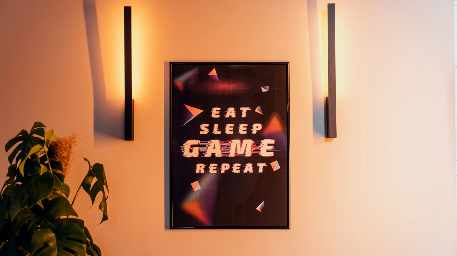 Ein Poster im Gamingzimmer mit der Aufschrift: Eat, Sleep, Game, Repeat