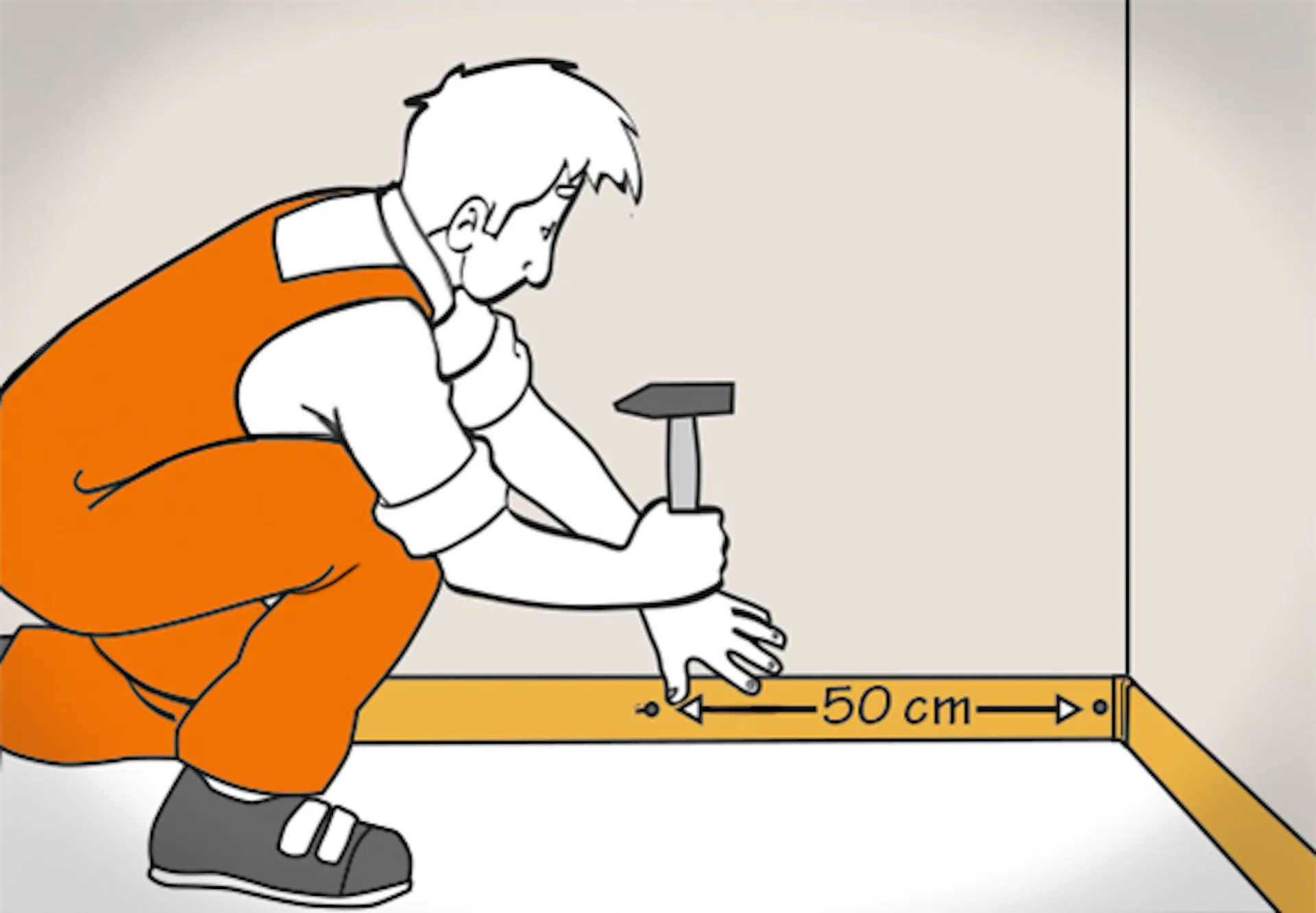 Una persona inchioda un battiscopa a intervalli regolari