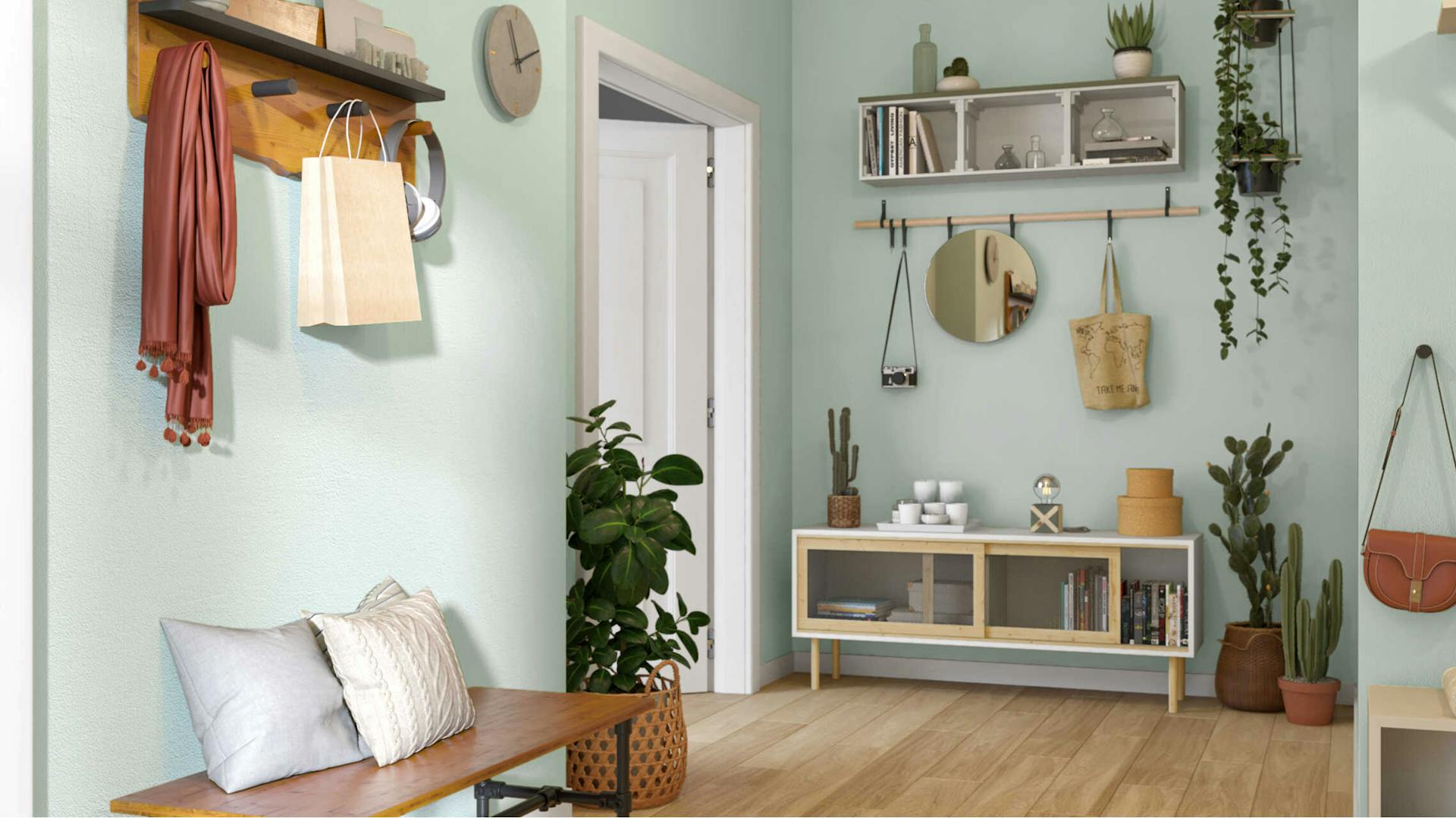 Ein heller Flur mit Holzparkett, in dem vorne Bank Rohrberta und im hinteren Bereich Sideboard Jona stehen.