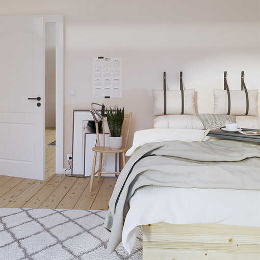 Ein Schlafzimmer mit beigen Wänden und einer Einrichtung in hellem Holzen.] 