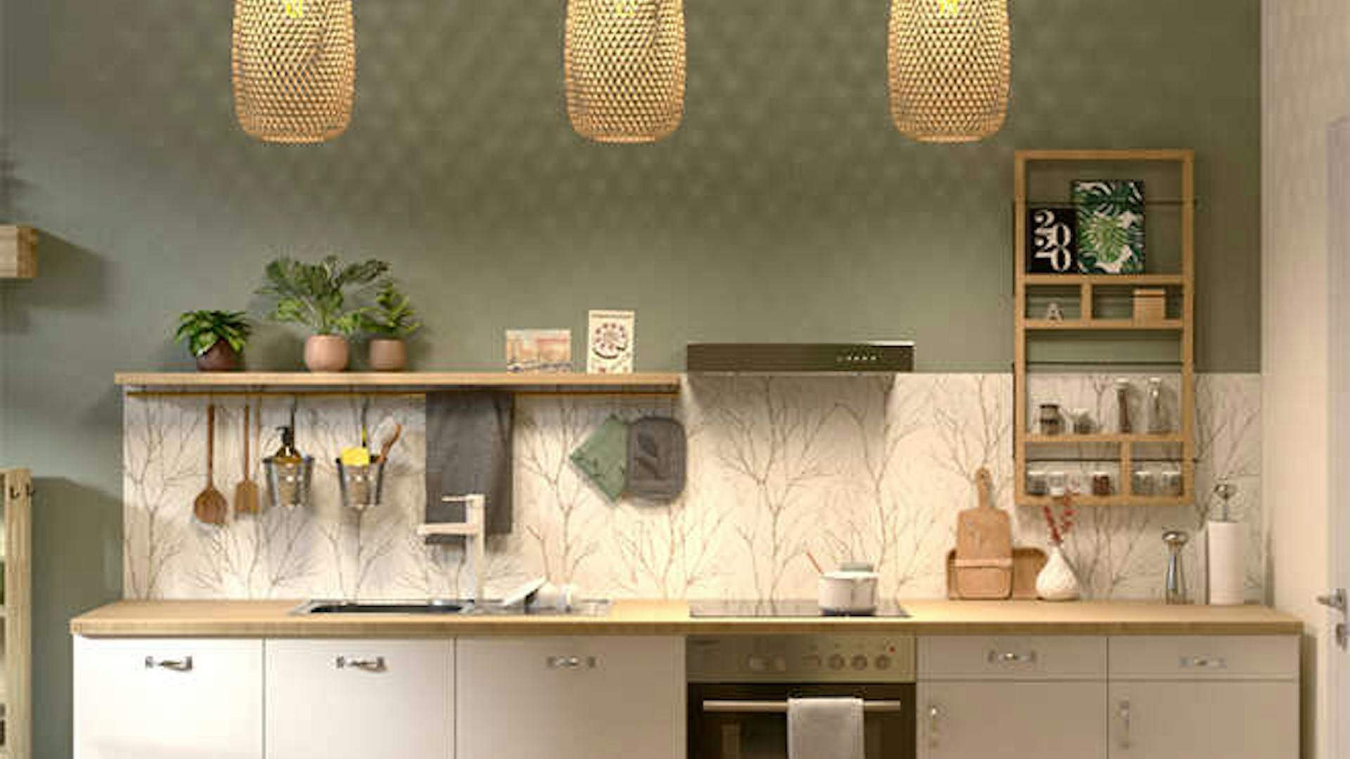 Küchenzeile mit weißen Fronten, einer hölzernen Arbeitsfläche und einer Küchenrückwand aus Tapete mit Zweigmuster.