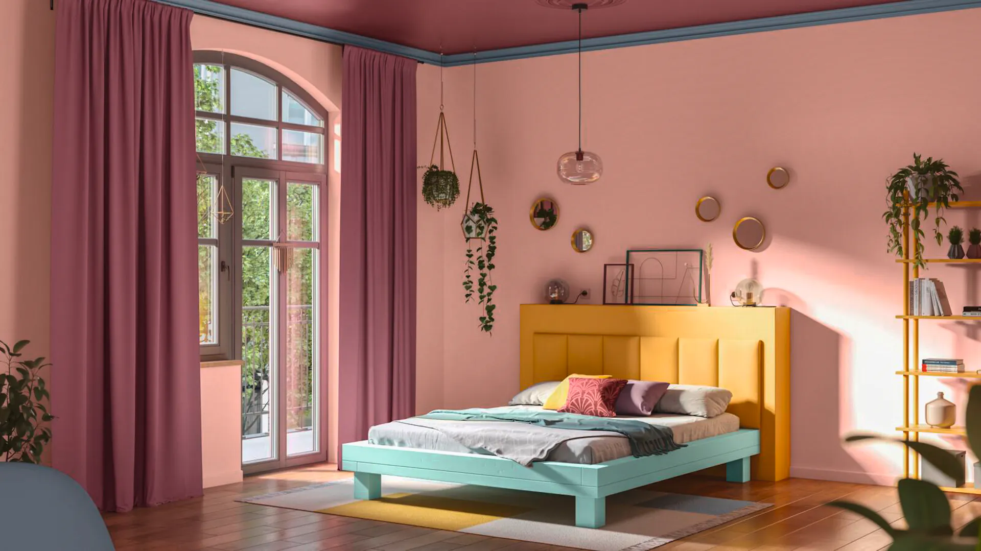 Bett in Wasserblau vor Wand in Quarzrosa