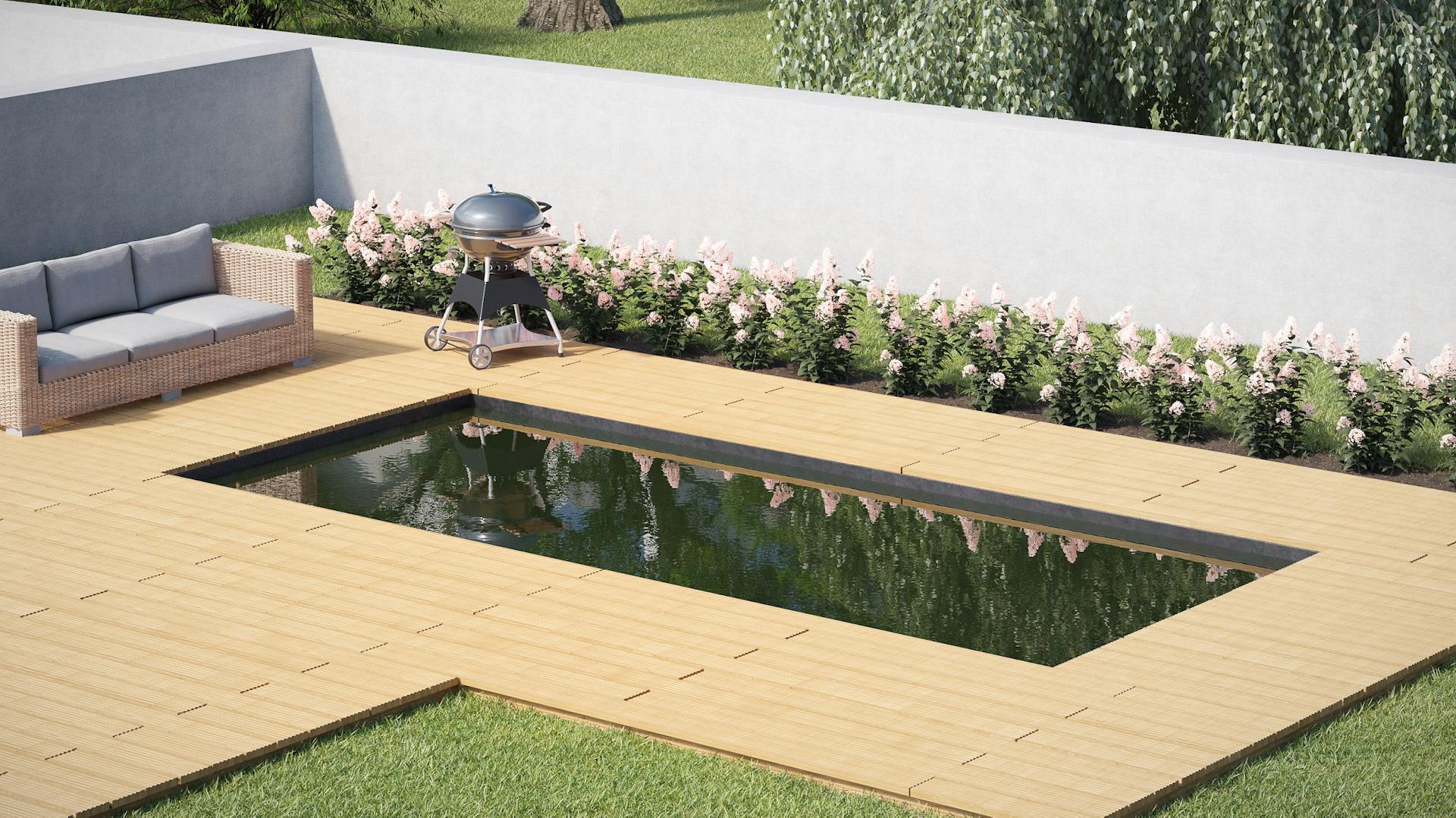 Ein Pool mit Gartenmöbeln und Grill an einem Beet vor einem mit Beton verputzten Sichtschutz.