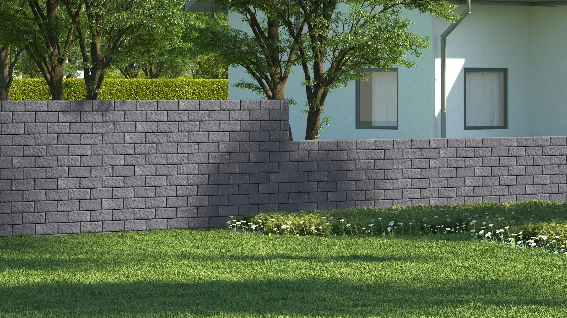 Ein Sichtschutz bestehend aus einer grauen Mauer.