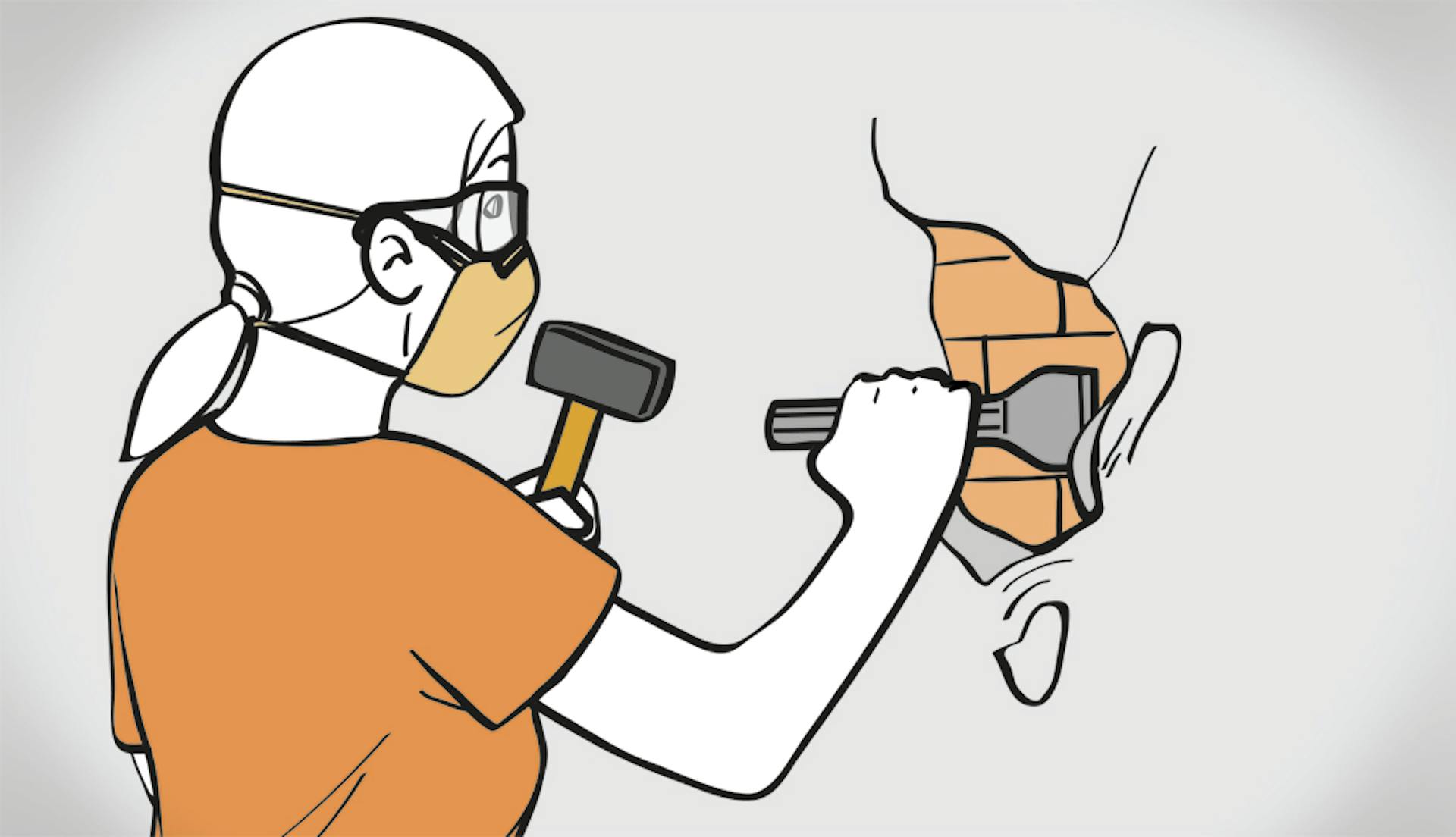 Žena stojí s kladivom a dlátom pred stenou.