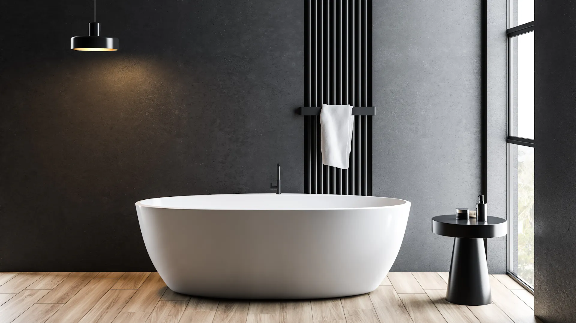 Biała wanna wolnostojąca w szarej łazience