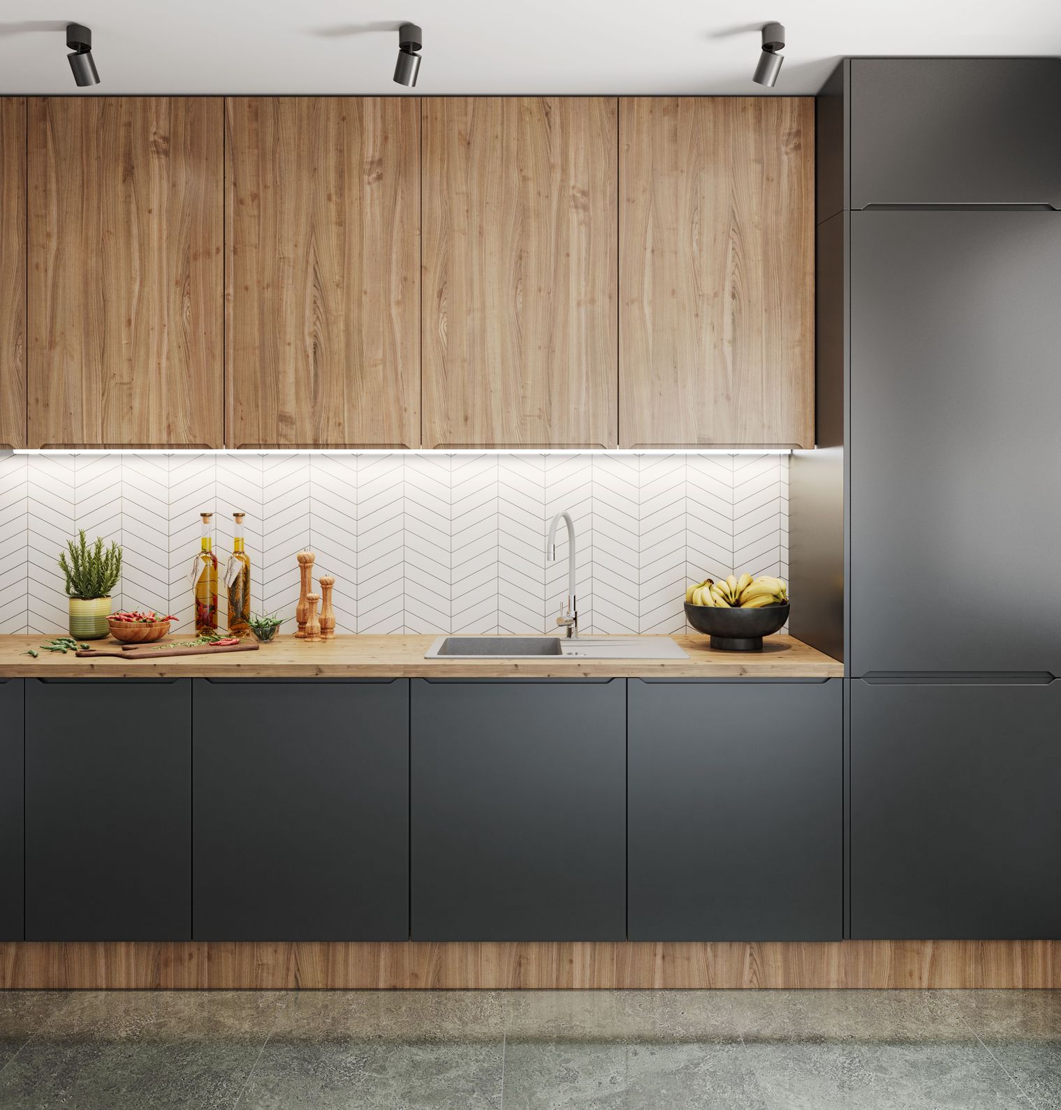 Drewiany blat kuchenny zamontowany na czarnych meblach.