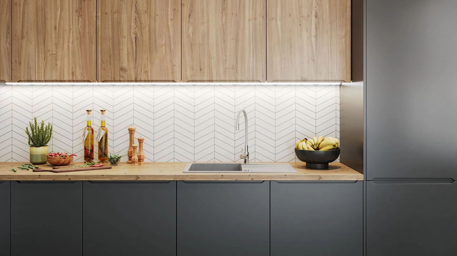 Drewiany blat kuchenny zamontowany na czarnych meblach.